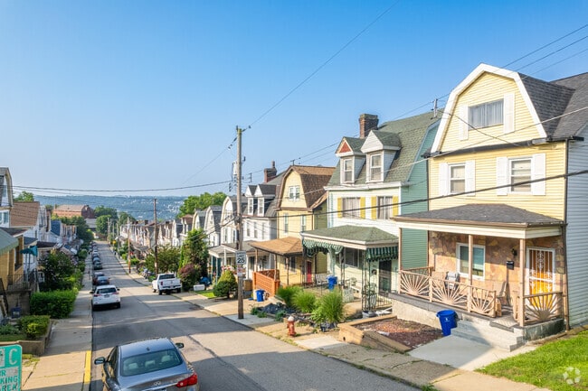 Many of the homes in West Oakland lie on hilly streets with large front porches.