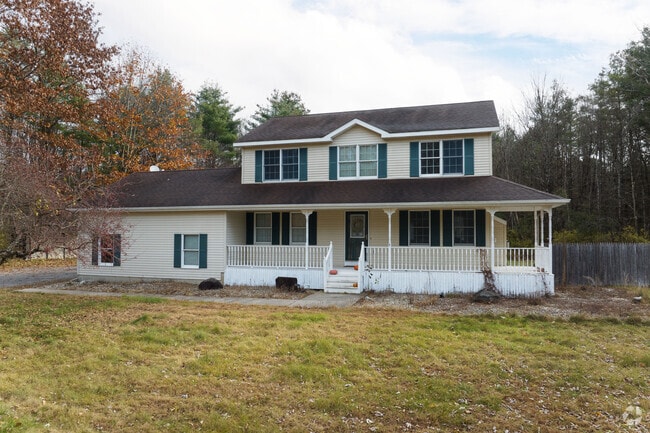 A large porch wraps around this colonial home in Galway.