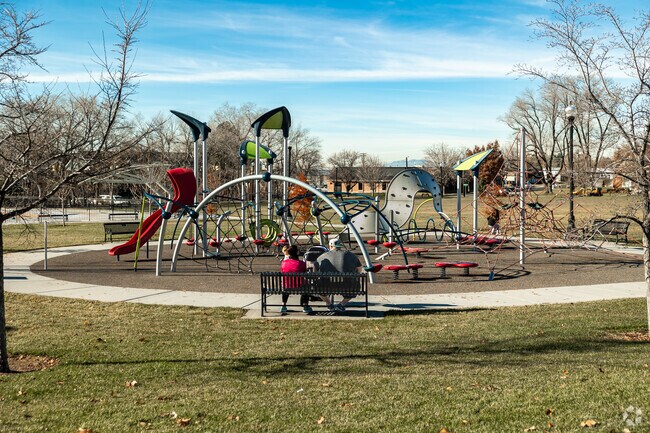 Fruit Heights families hang out at the playground in Heritage Park.