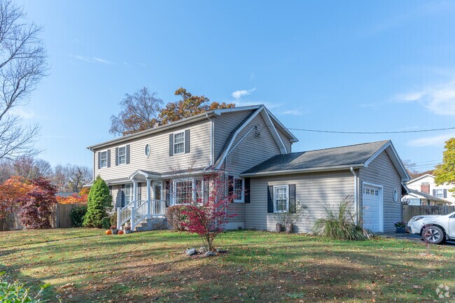 You will find this nice colonial with a garage extension on Red Bush Lane in Post Road North.