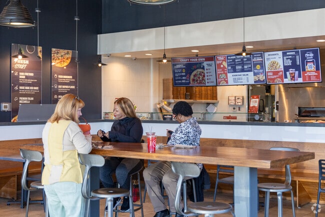 Vibrant moments at Hamilton Forest's bustling Pieology restaurant.