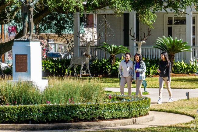A group of friends enjoy a sunny day in St Martinville, Louisiana.
