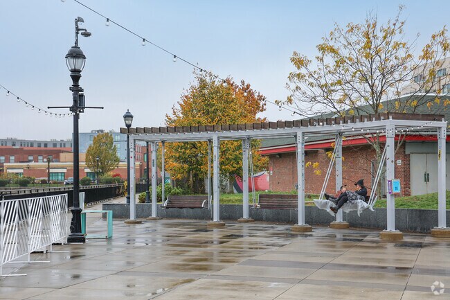 Families in The Point gather along the scenic Salem Harbor Walk to enjoy the waterfront swings and lively community events.