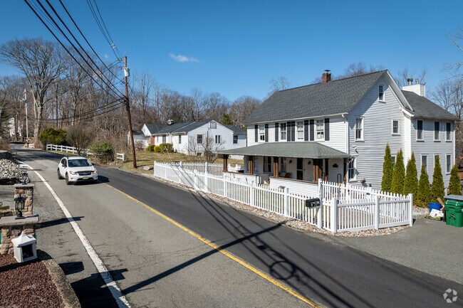 Modest homes with nearby neighbors adorn the commonly winding and undulating streets of Boonton Township.