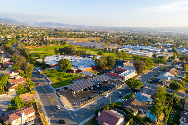 Green energy under solar-covered parking at Serrano Middle School.
