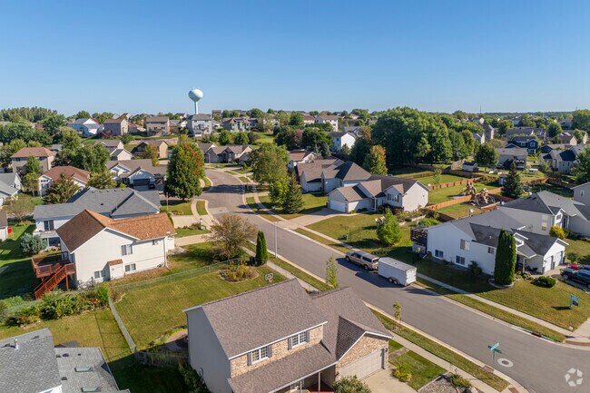 Trees shade driveways in Northwest, creating a cozy neighborhood feel.