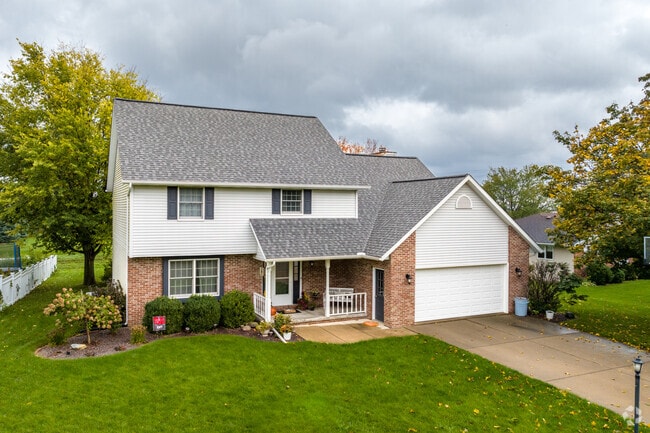 Morton street lined with two-story houses featuring front-facing garages.
