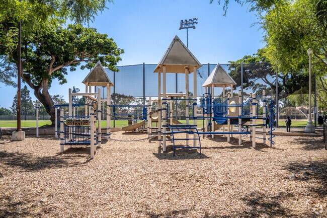 Community Center Park East features a large playground area for children to enjoy.