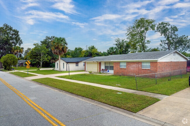 Charming ranch-style homes in neighborhood K boast pristine lawns.