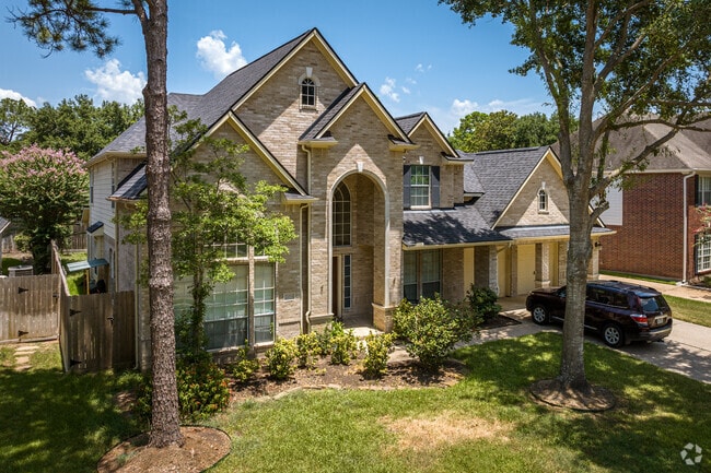 This is an example of a Neo-Classical style home located in Cinco Ranch.