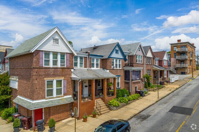 Rowhomes rise along a quiet hill in Wilmington’s Flats neighborhood.