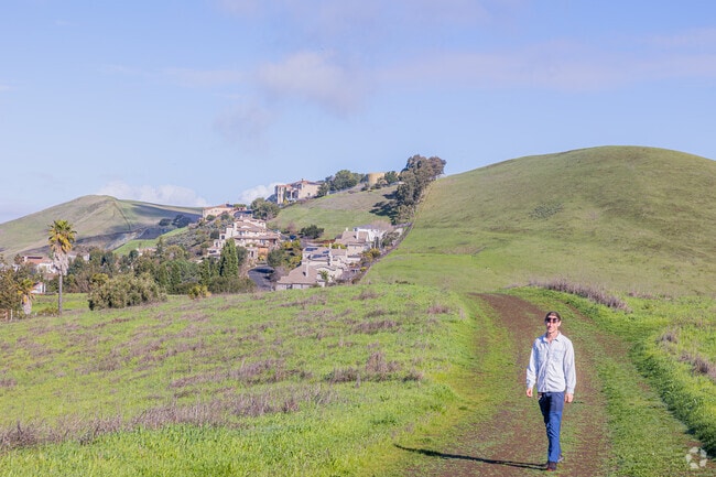 Man relishes scenic ridgeline trails above Mission-Garin neighborhood.