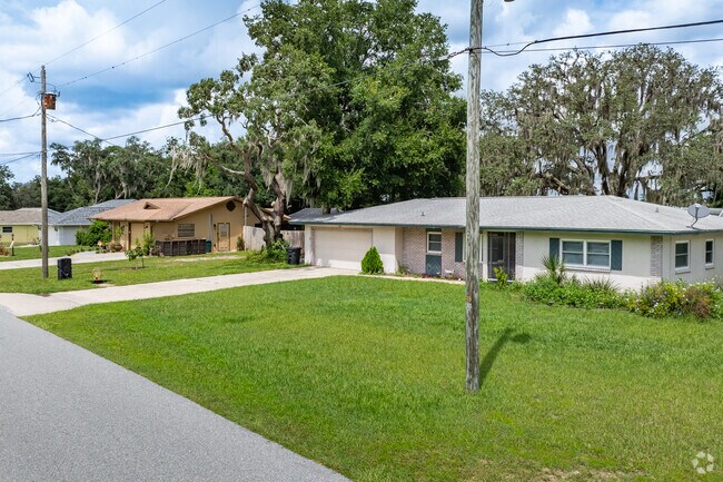A beautiful row of homes on a cozy street in Mayfair Garden Acres.