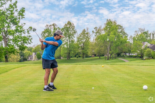 A resident of the Idle Creek Golf Community enjoys a game on the 18-hole championship course.