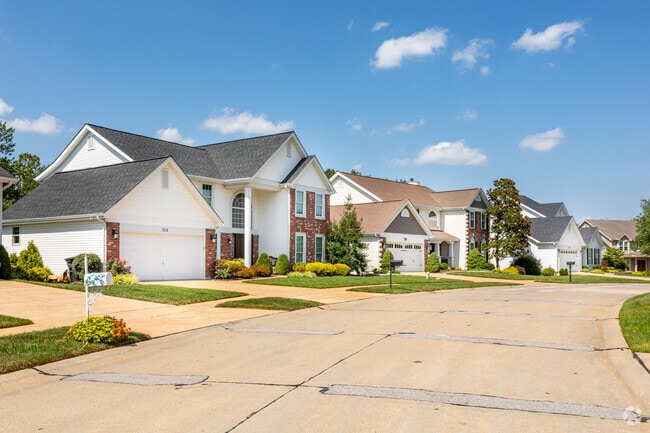 Traditional style homes with brick accents bring a classic architectural feel to Ballwin.