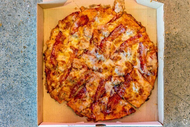 Thin crust, square cut and Provel cheese, is what makes the St. Louis style pizza at Imo's.