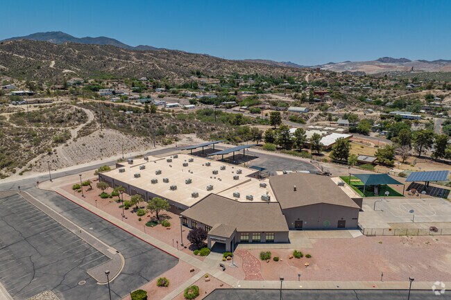 This view of Dr. Charles A. Bejarano Elementary School highlights its central building layout and surrounding access roads.