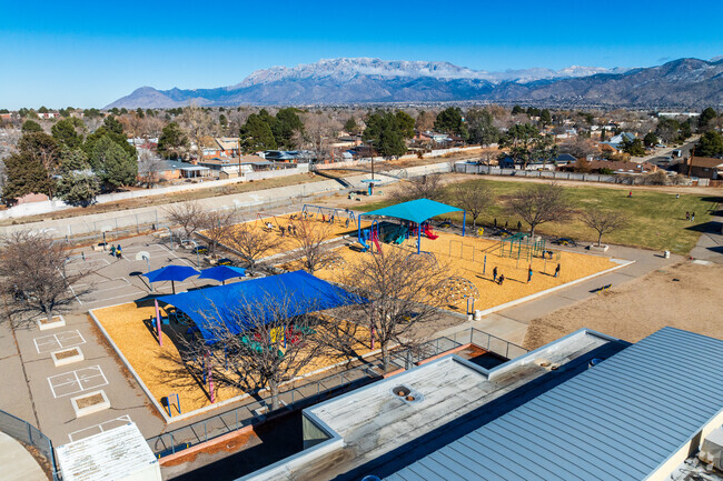 Students safely play in the fenced in playground at Bellehaven Elementary School.