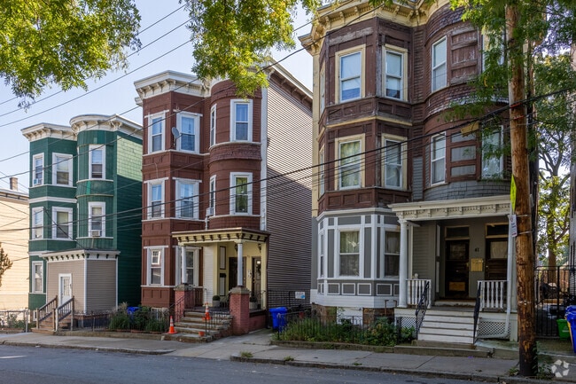 Rows of triple decker homes line the streets of Dudley-Brunswick King.