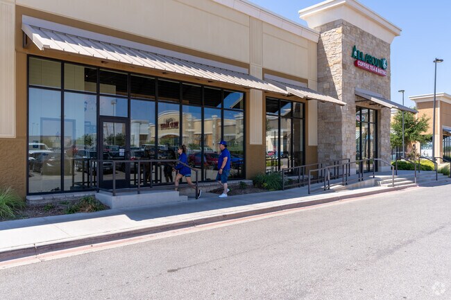 People go into the All About Coffee Tea & Bistro at the West End Center.
