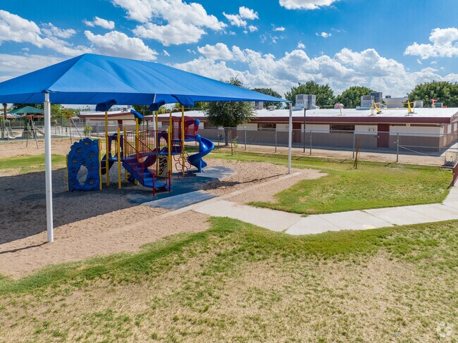 Holiday Park School's shaded playground is popular during recess.