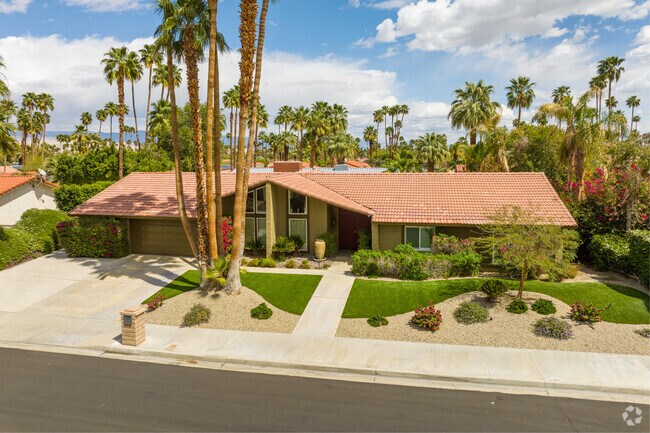 Residents enjoy relaxing under palm trees in the private backyards of Sonora Sunrise homes.