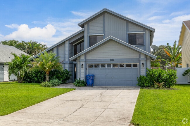 Two-story single-family home in the North Palm Beach Heights neighborhood.