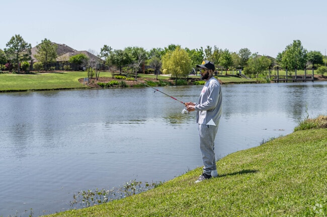 A fisherman casts a line at a pond in Rosharon, Texas.