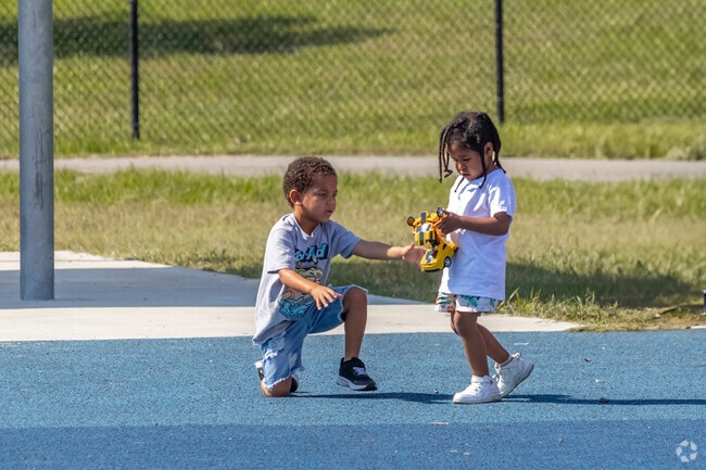 Lakefront Park is the perfect backdrop for a playdate among Port Acres friends.