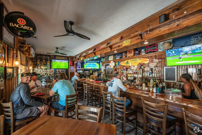 Residents and visitors of Cheat Lake gather for food and drinks at the Lake House Lounge.