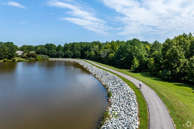 Enjoy a walk around the lake on a paved trail at Croasdaile Farm.