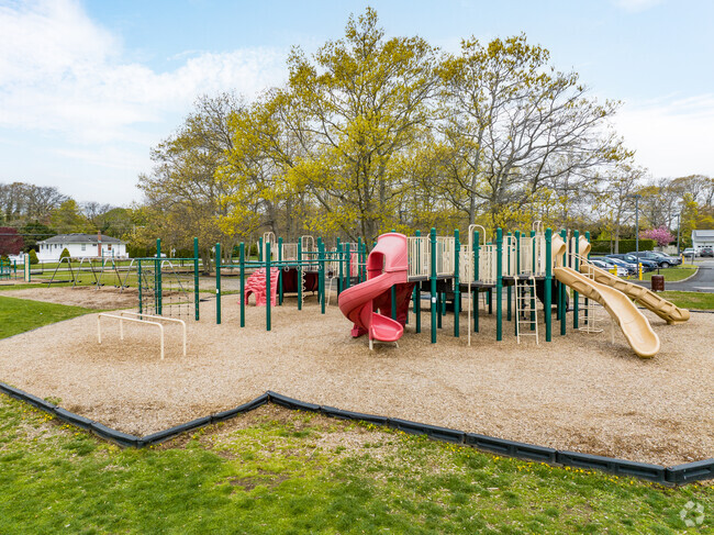 Theres a big playground on the side of South Country Elementary School.