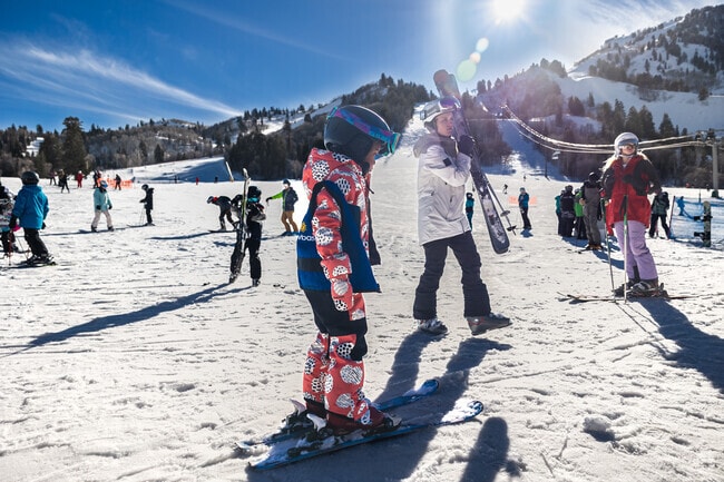 Guests enjoy a day of skiing and snowboarding at Snow Basin in not far from Perry.