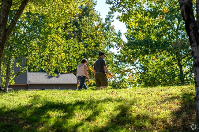 Brickyard Road-Queensgate features Brickyard Road Park with open green spaces for relaxation.