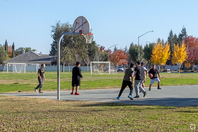 Play a game of basketball at Lions Park in Kerman.