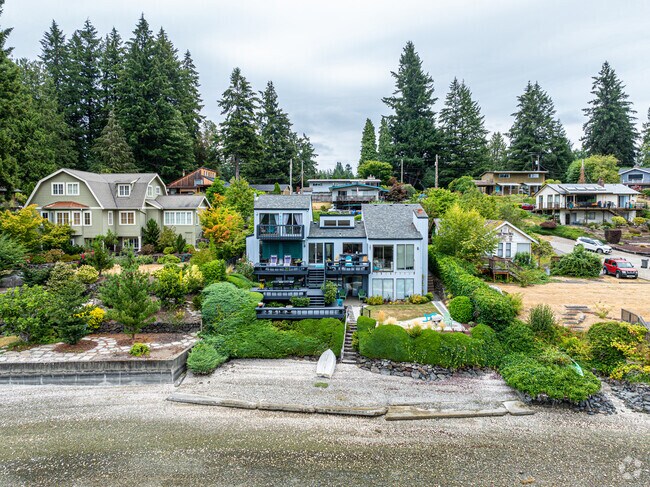 This is a more contemporary home with multiple decks to enjoy the view.