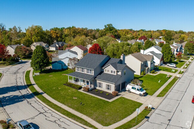 An American style home with a porch and 2 door garage on Claudius St in Avon.