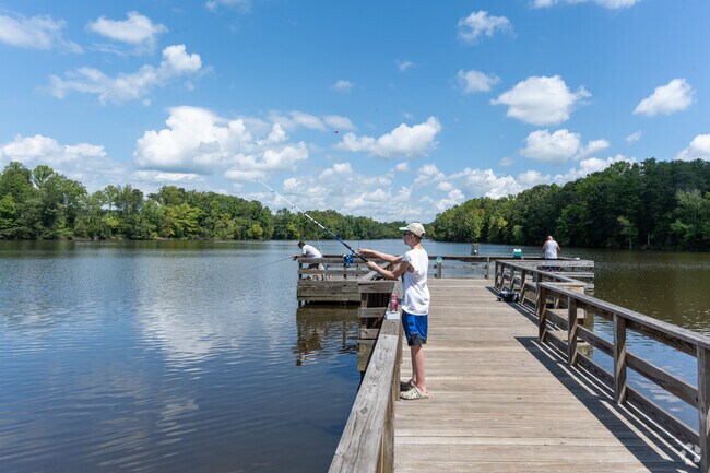 Residents enjoy fishing from the dock at Graham-Mebane Lake near Woodlawn.