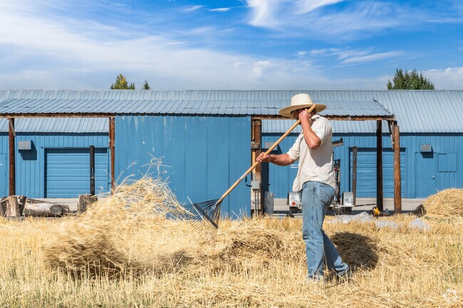 A man harvests an artwork that was planted at Tinworks Art Exhibit in Bozeman's Northeast neighborhood.