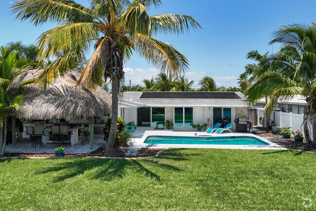 Traditional single-family home with a pool in the backyard in Boulevard Park Isles.