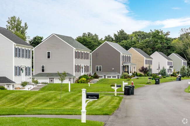 Touisset neighborhood homes feature fresh lawns and a classic suburban ambiance.