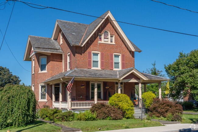 Richland homes frequently include steep gable roofs and brickwork.