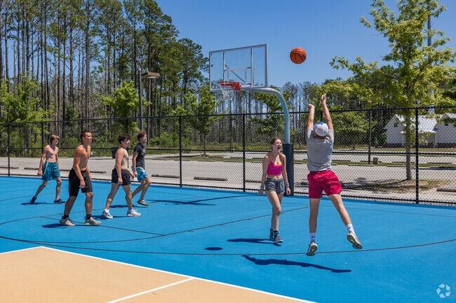 Shoot hoops with friends on the courts at the Carolina Park Soccer Fields near Darrell Creek.