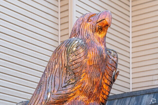 A carved bald eagle statue stands outside the Glenfield Valley Veterans Club.