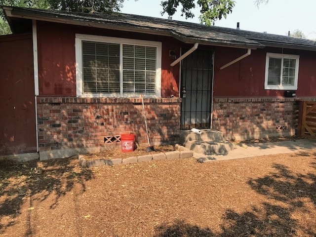FRONT OF DUPLEX WITH FRONT YARD & FENCED IN