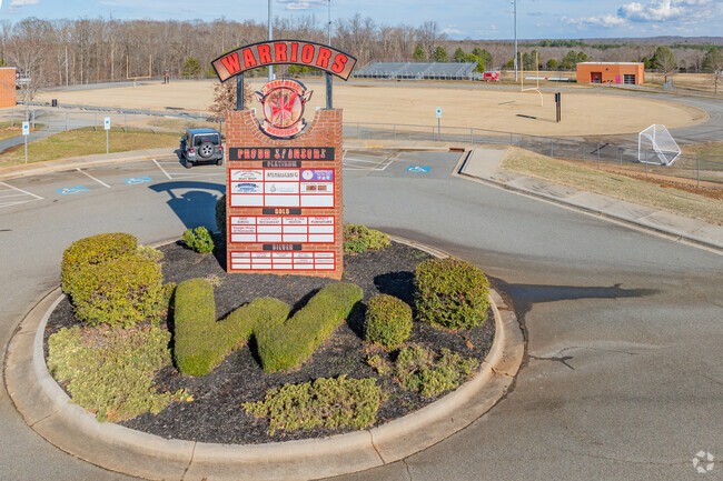 Wheatmore High School sponsors sign and football field.
