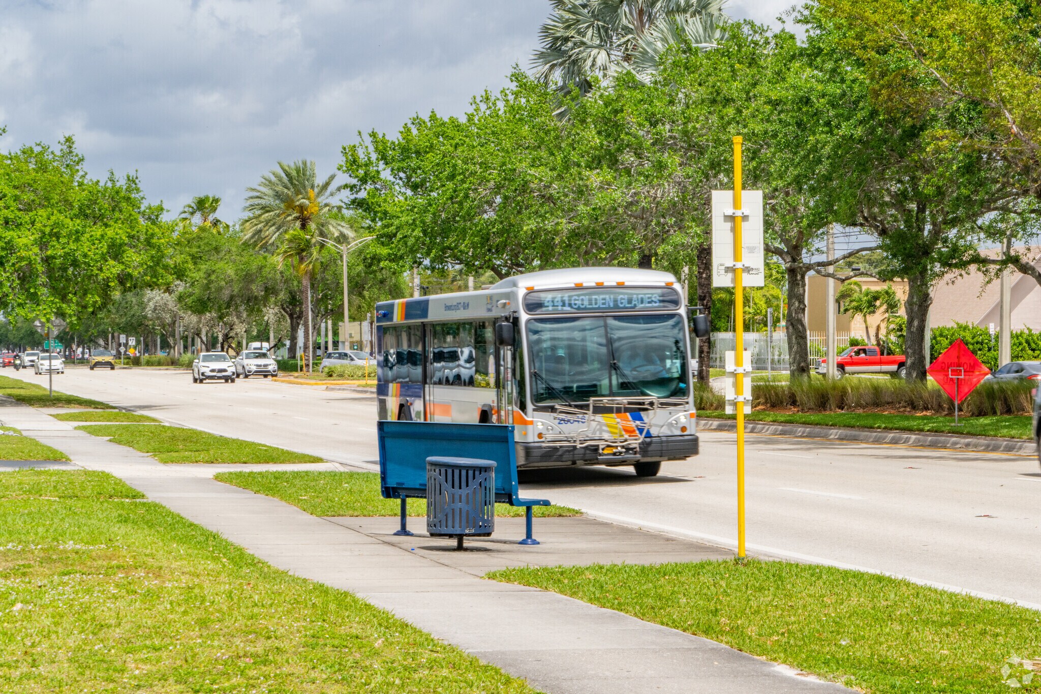 Bustling with activity, the bus stop near Eastway Park connects visitors to the city.