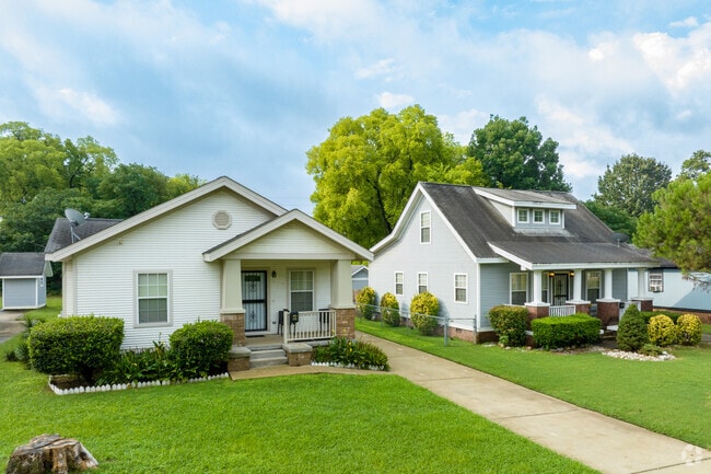 This row of Craftsman-style houses watch over this quiet Thomas street.