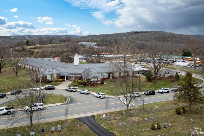 Set against open skies and rolling fields, this elementary school is more than a place to learn—it’s a proud community cornerstone with heart.