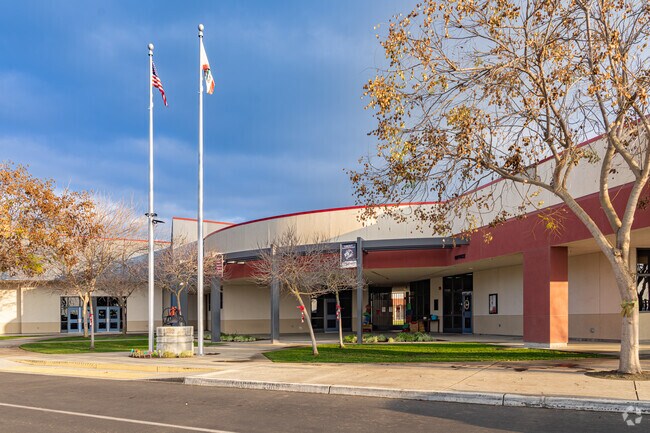 An American flag waves outside the entrance to Liberty Elementary School in Tulare.